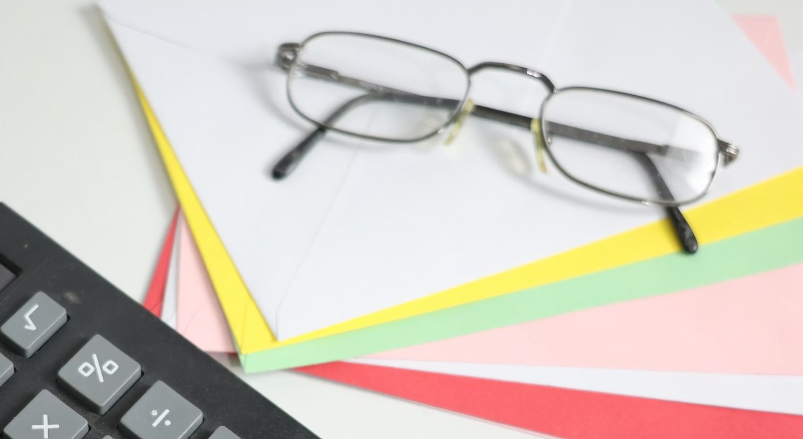 Calculator and financial documents illustrating wealth management fee comparison for high net worth investors in New England